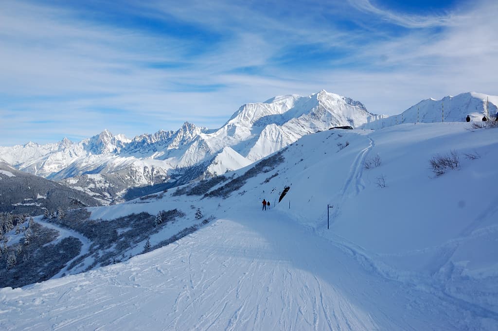 skiing down cat track in Megeve with a great view of the mountains